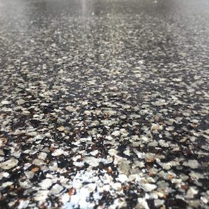 A colored Epoxy flooring flakes product that may be mixed with a variety of materials such as clear or pigmented gel coat, polyurethane, or epoxy and sprayed directly onto the desired surface.